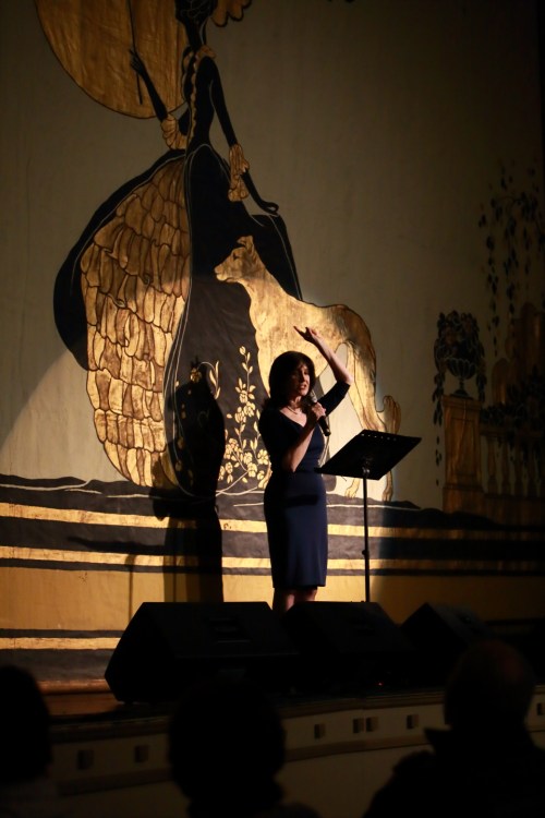 Joyce Kulhawik, in front of the restored fire curtain